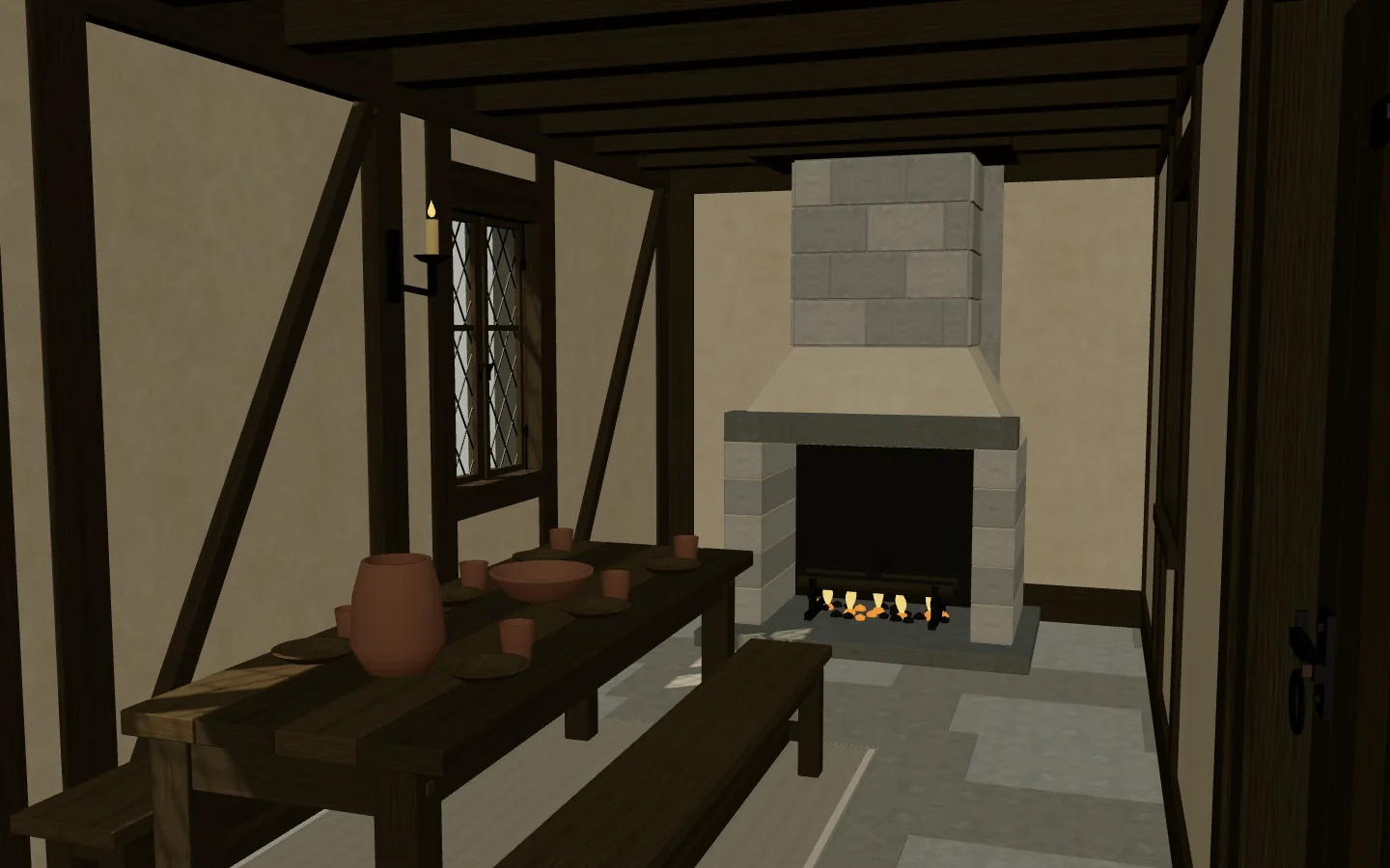 The great hall interior with its hearth, long table, and exposed ceiling joists.